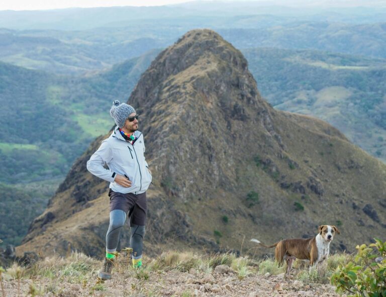 Explore the stunning mountain landscapes of Costa Rica with a hiker and his dog.