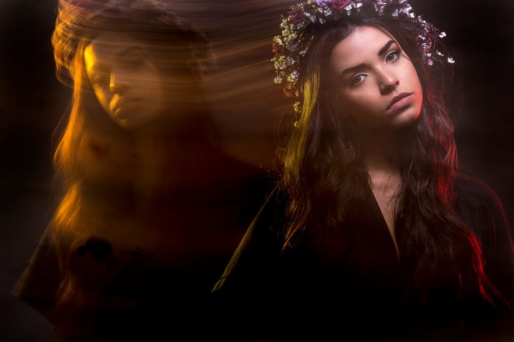 A creative portrait of a woman using long exposure, capturing artistic motion and ambient light.