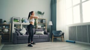 Woman doing workout in a stylish living room, emphasizing healthy lifestyle and modern design.